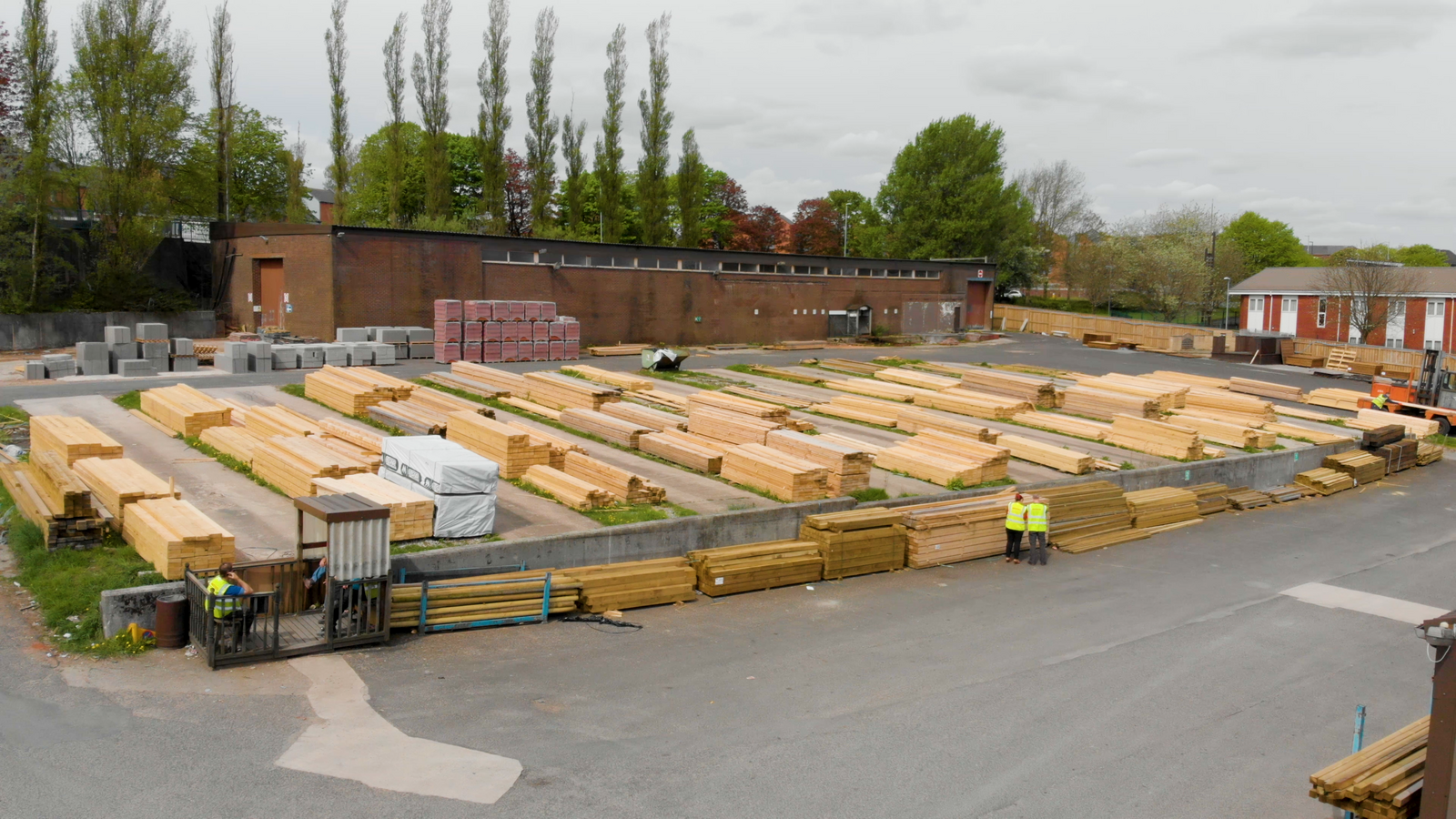 Stacks of freshly milled Canadian timber at a lumber yard